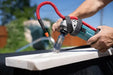 a person is using Hydro-Tail Controlled Water Attachment